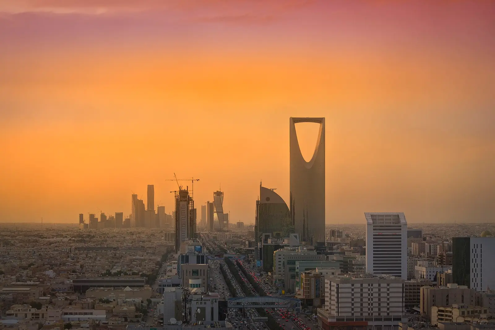 Riyadh skyline at sunset with the Kingdom Centre tower and the financial district
